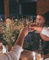 people sharing wine in open setting